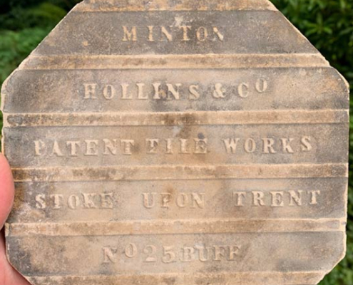 Reverse of an original Minton Victorian geometric floor tile showing the embossed manufacturer's stamp from Minton Hollins & Co, Patent Tile Works, Stoke-on-Trent.