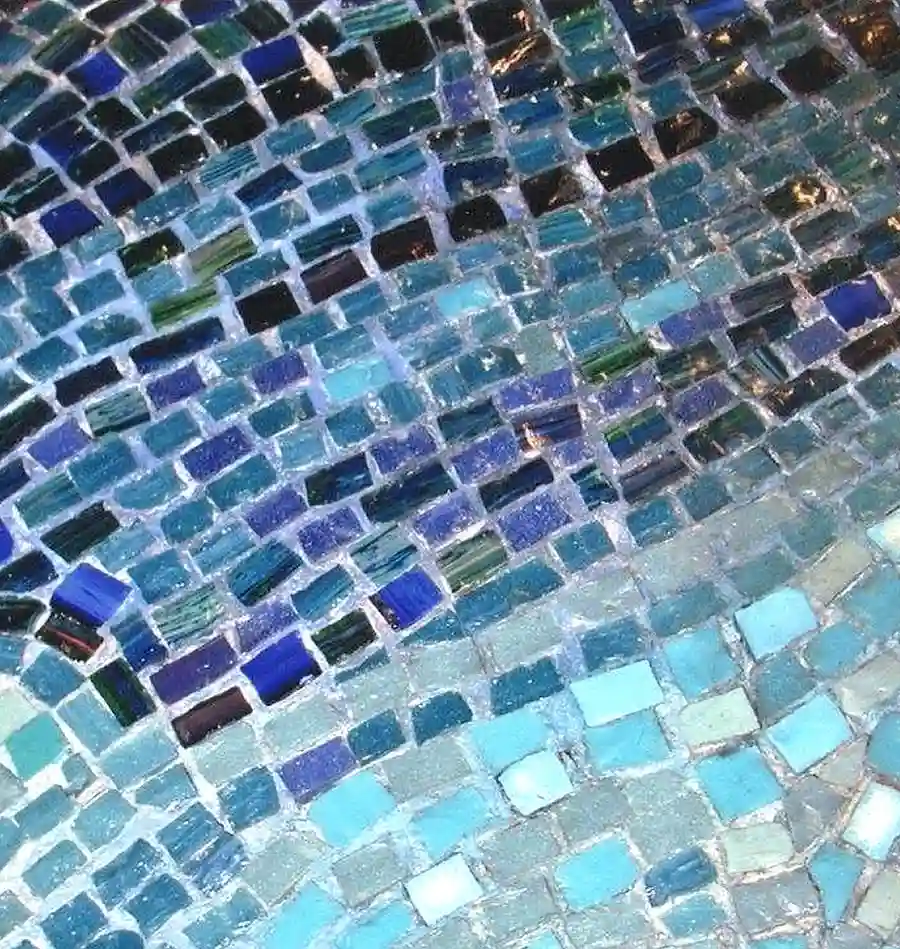 Close-up of a historic marble mosaic floor during specialist conservation cleaning in Edinburgh, revealing the original blue glass and marble tesserae while preserving the historic fabric.