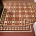 New Victorian geometric tile floor installation in a period property in Pollokshields, Glasgow, featuring traditional red, cream and black tiles with decorative borders.